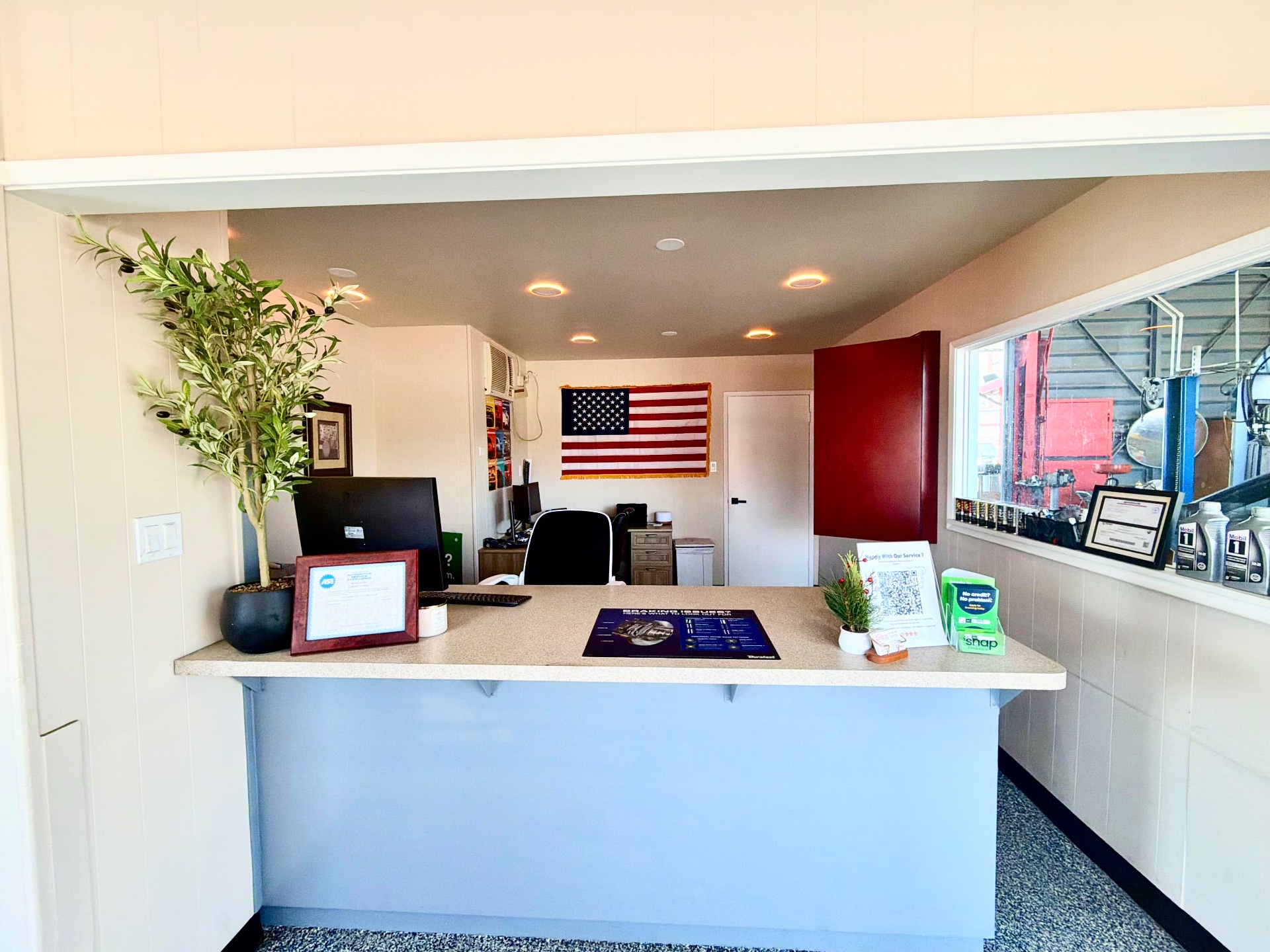 Welcoming front desk and customer lobby at Downtown Fixus